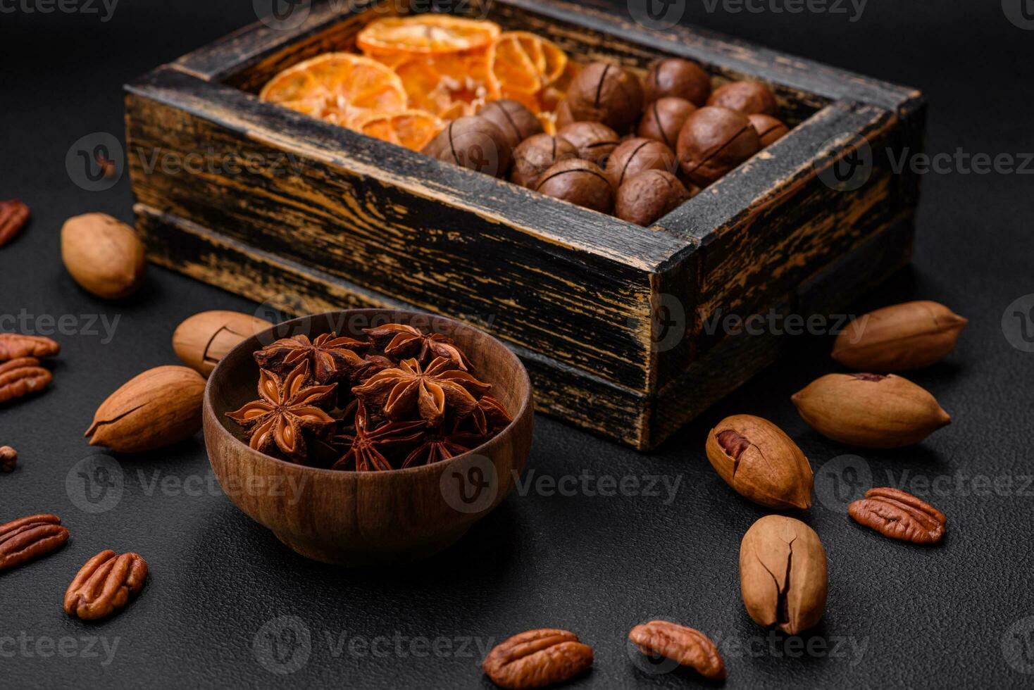 Roasted pecans and macadamia nuts, dried tangerine, dried berries photo