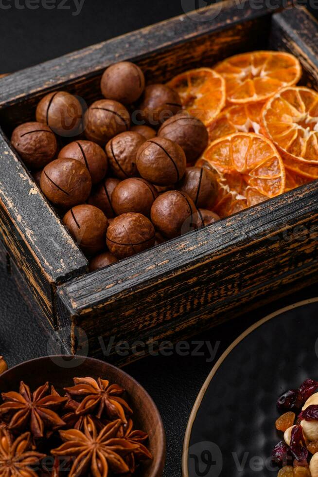 Roasted pecans and macadamia nuts, dried tangerine, dried berries photo
