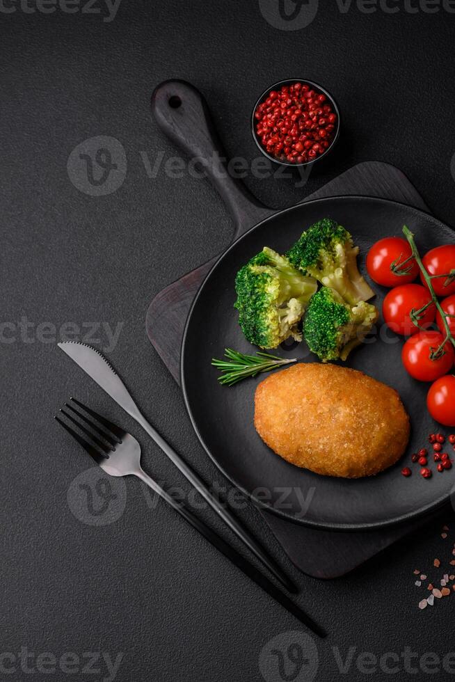 Delicious baked cutlet breaded with spices, salt and herbs photo