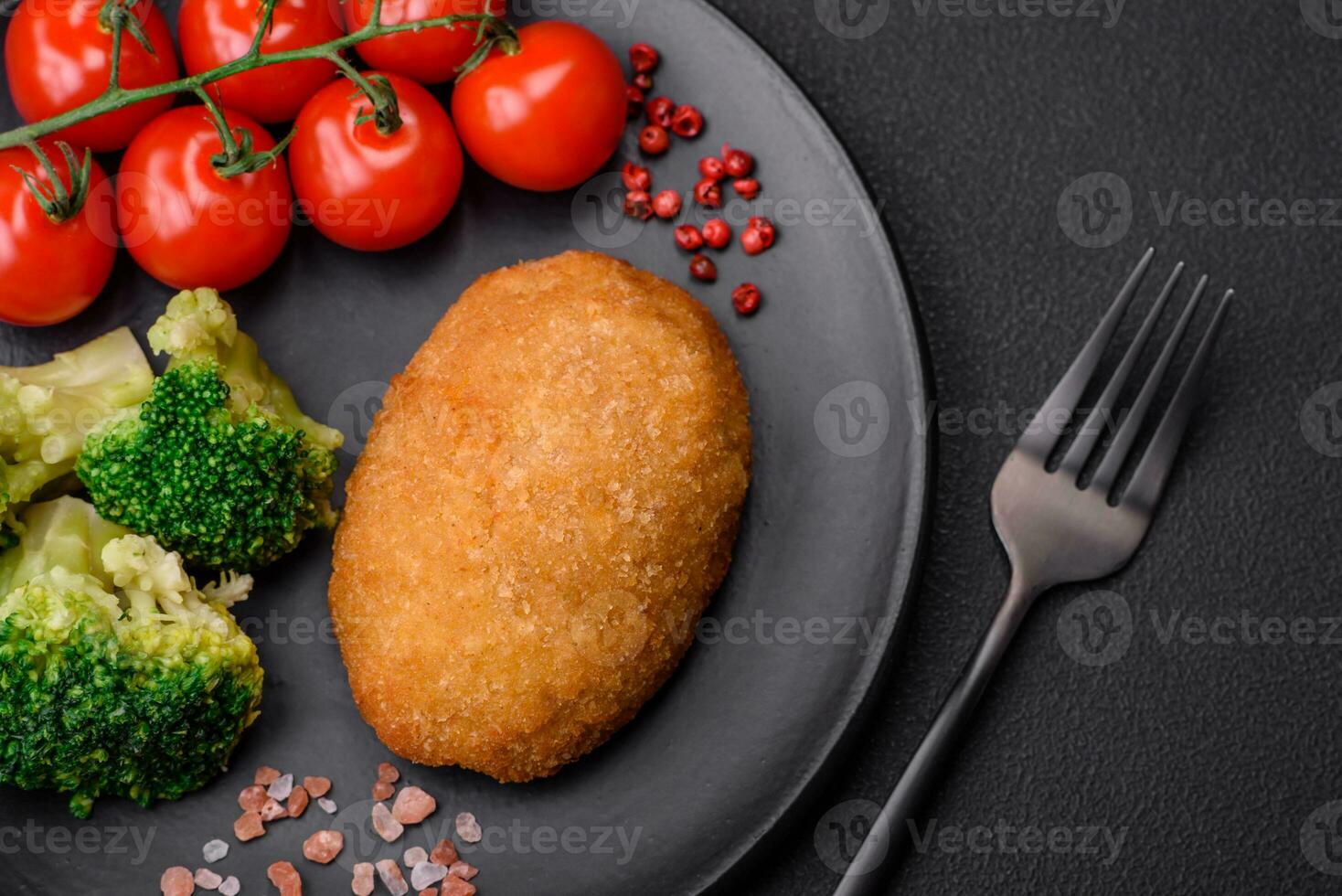 Delicious baked cutlet breaded with spices, salt and herbs photo