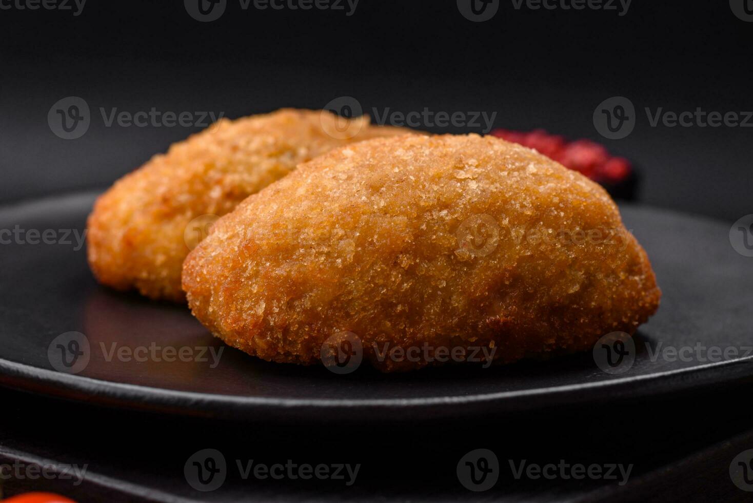 Delicious baked cutlet breaded with spices, salt and herbs photo