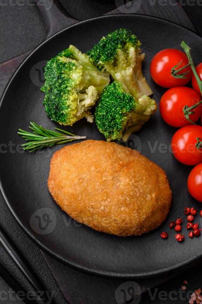 Delicious baked cutlet breaded with spices, salt and herbs photo