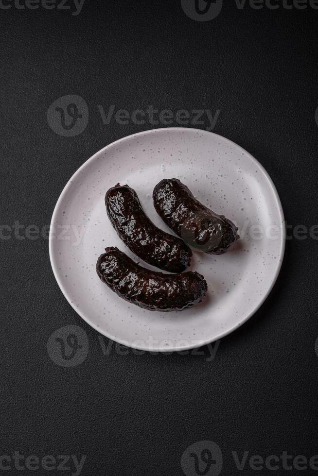 Delicious black blood sausage or black pudding with spices and herbs photo