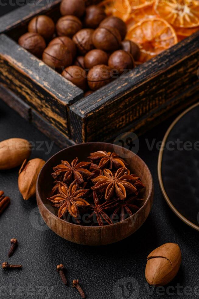 Roasted pecans and macadamia nuts, dried tangerine, dried berries photo