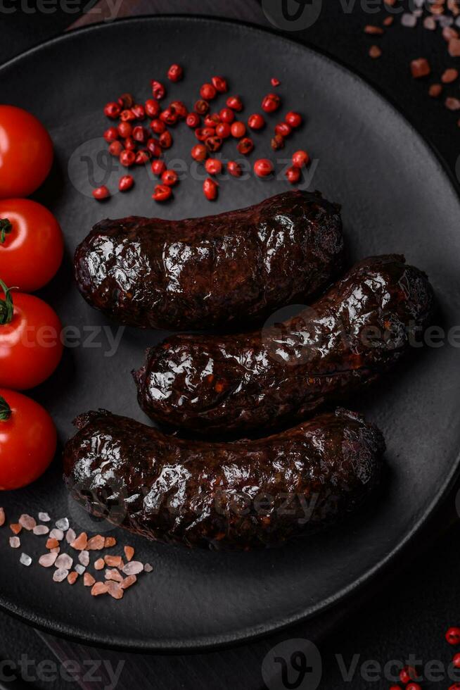 Delicious black blood sausage or black pudding with spices and herbs photo