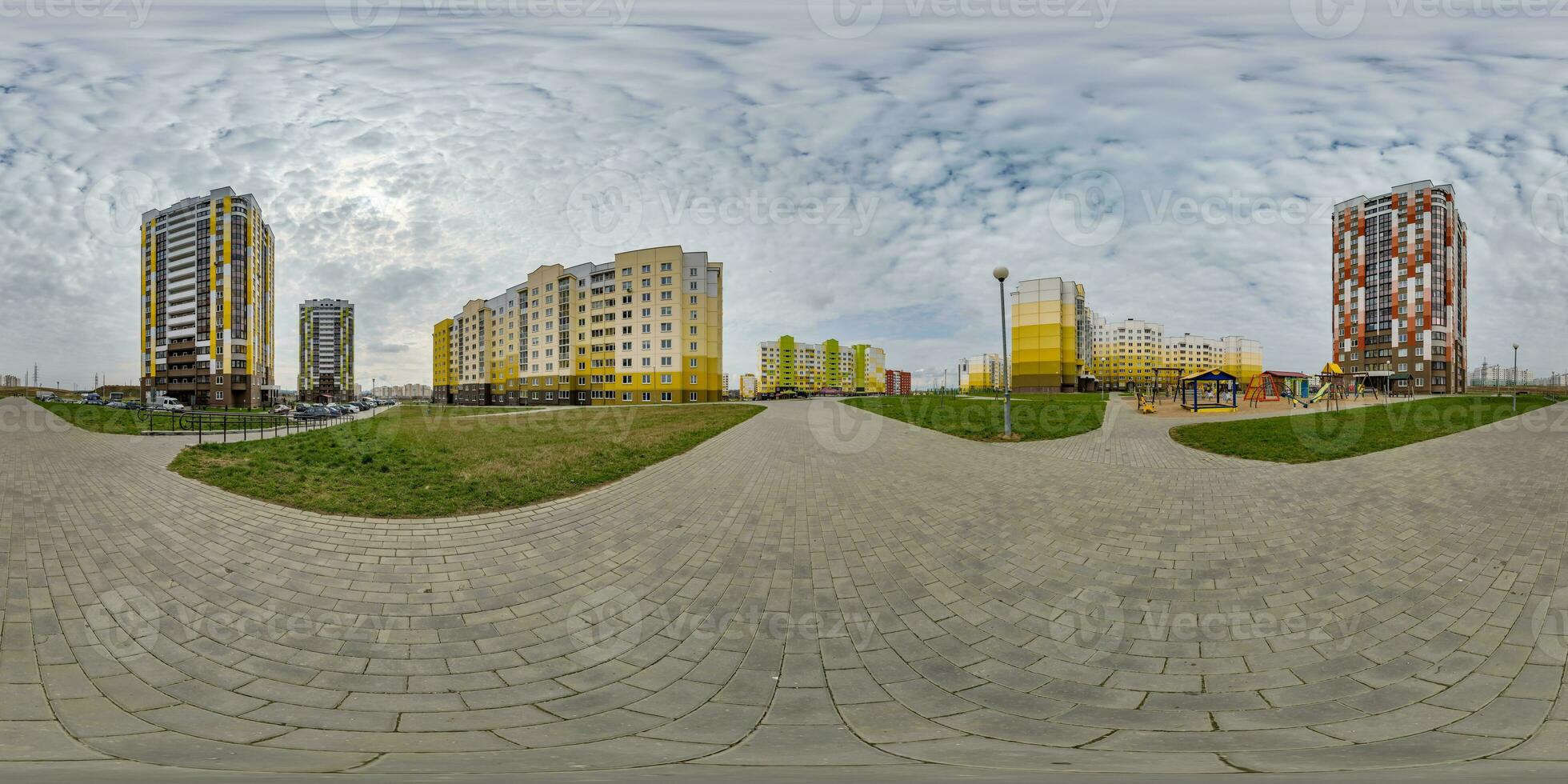 360 hdri panorama view with skyscrapers in new modern residential complex with high-rise buildings in townwith overcast sky in equirectangular spherical projection, ready AR VR virtual reality content photo