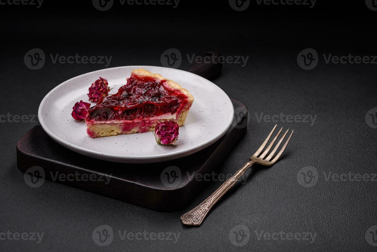 Delicious fragrant sweet pie with cherry berries on a ceramic plate photo