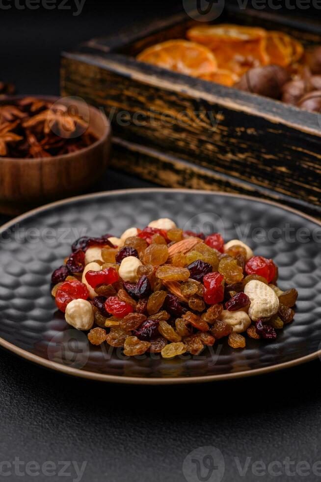 Roasted pecans and macadamia nuts, dried tangerine, dried berries photo