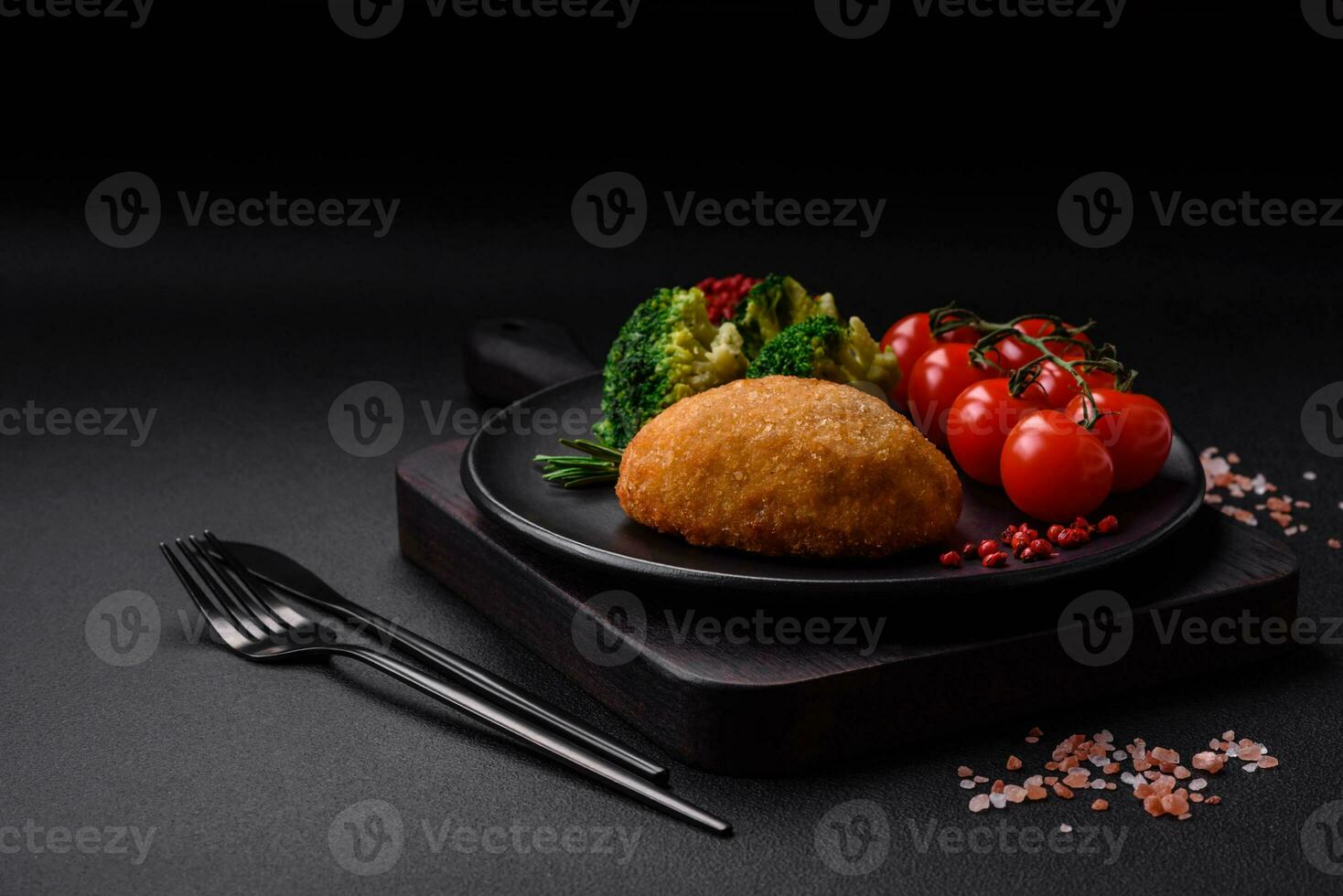 Delicious baked cutlet breaded with spices, salt and herbs photo