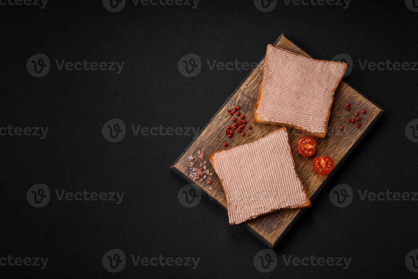 Delicious crispy toast with chicken or goose pate with salt and spices photo
