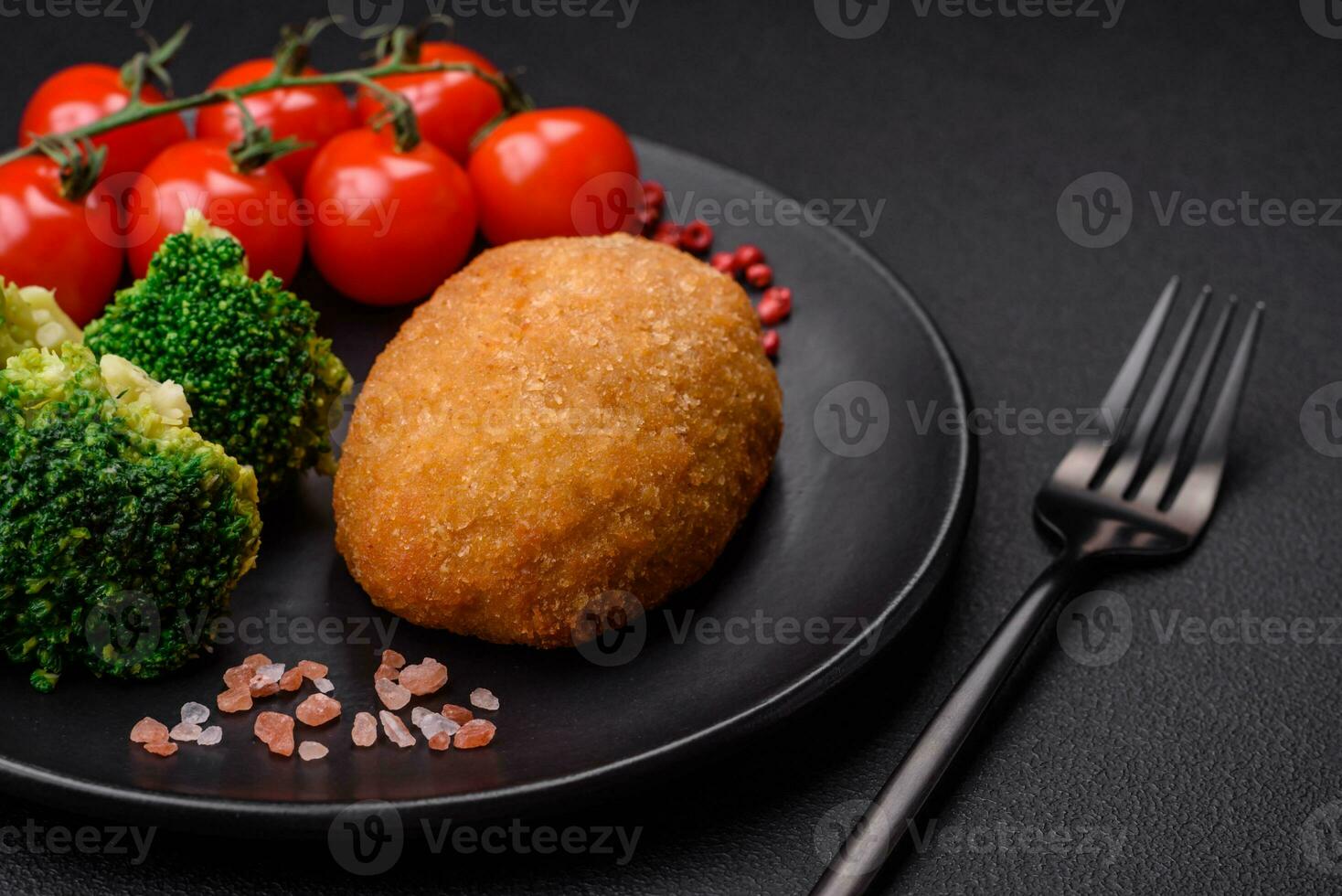 Delicious baked cutlet breaded with spices, salt and herbs photo