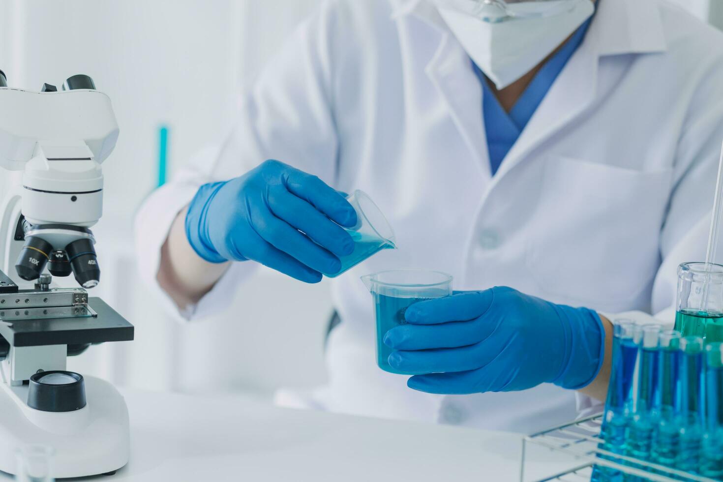 Medical Development Laboratory Caucasian Female Scientist Looking Under Microscope, Analyzes Petri Dish Sample. Specialists Working on Medicine, Biotechnology Research in Advanced Pharma Lab photo