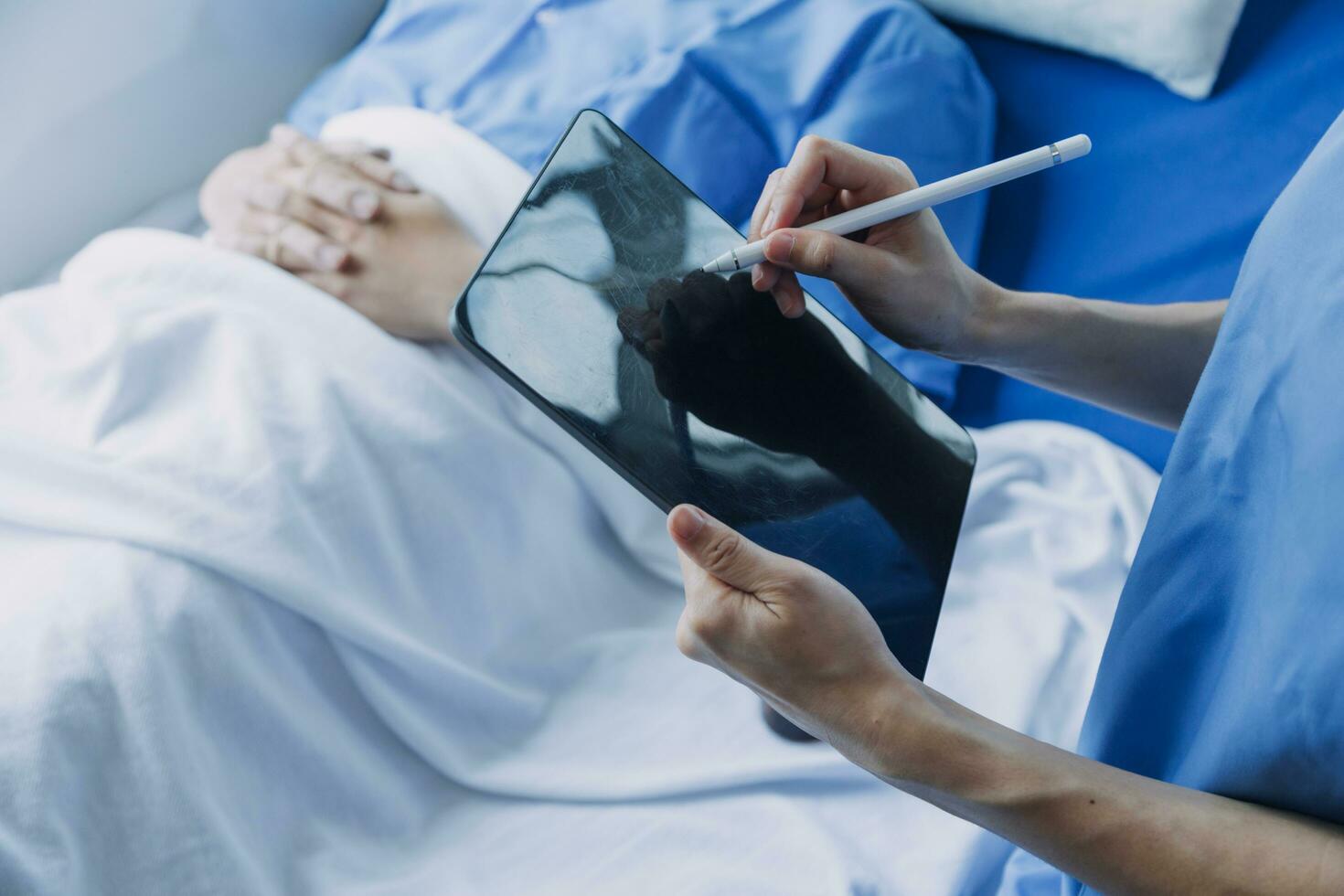doctor check up after surgery. doctor touching patient hand and consoling. photo