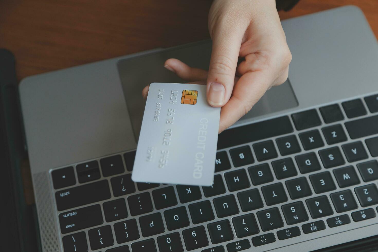 Women holding credit card and using smartphones at home.Online shopping, internet banking, store online, payment, spending money, e-commerce payment at the store, credit card, concept photo