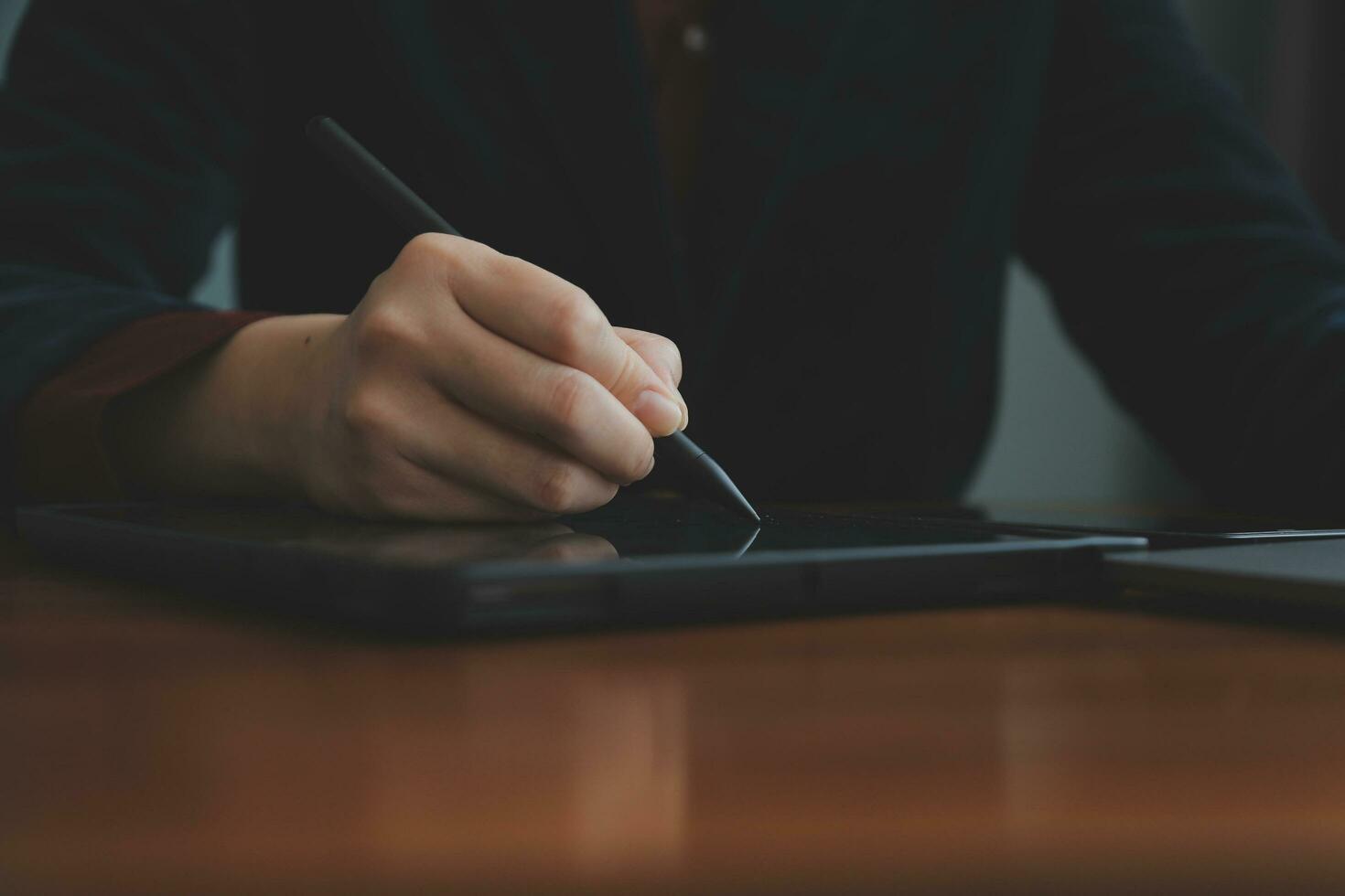 Asian Businesswoman Using laptop computer and working at office with calculator document on desk, doing planning analyzing the financial report, business plan investment, finance analysis concept. photo