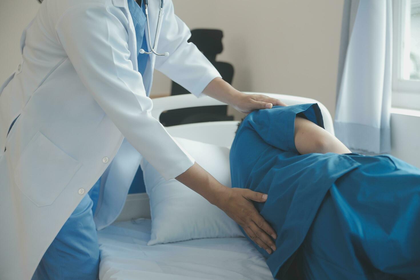 Physiotherapist working with patient in clinic, closeup photo