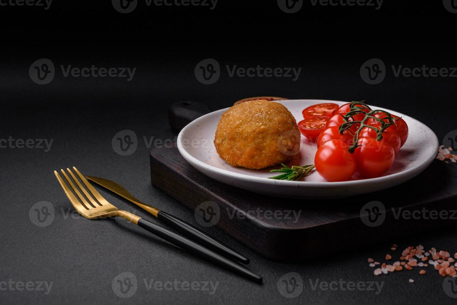 Delicious baked cutlet breaded with spices, salt and herbs photo