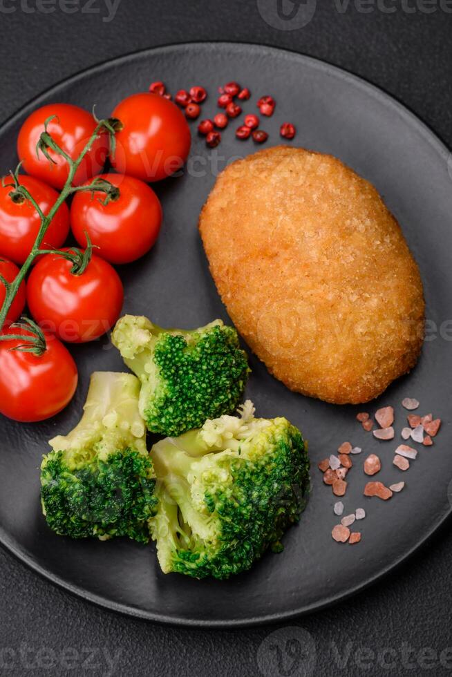 Delicious baked cutlet breaded with spices, salt and herbs photo