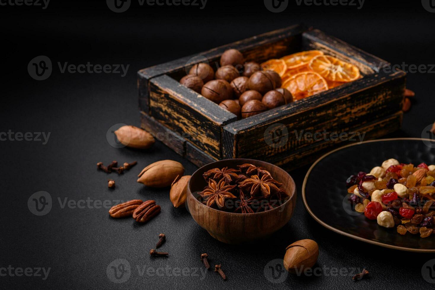 Roasted pecans and macadamia nuts, dried tangerine, dried berries photo