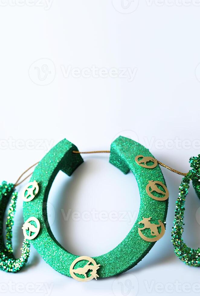 3D Render of Golden And Green Glittery Horseshoe Element And Copy Space. St. Patrick's Day Concept. photo