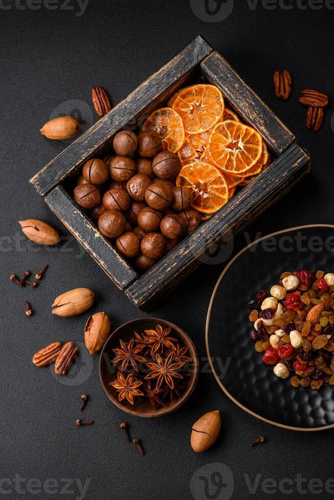 Roasted pecans and macadamia nuts, dried tangerine, dried berries photo