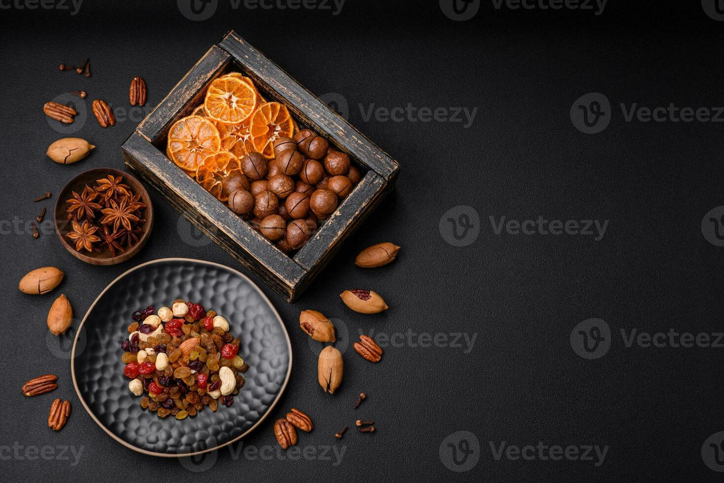 Roasted pecans and macadamia nuts, dried tangerine, dried berries photo