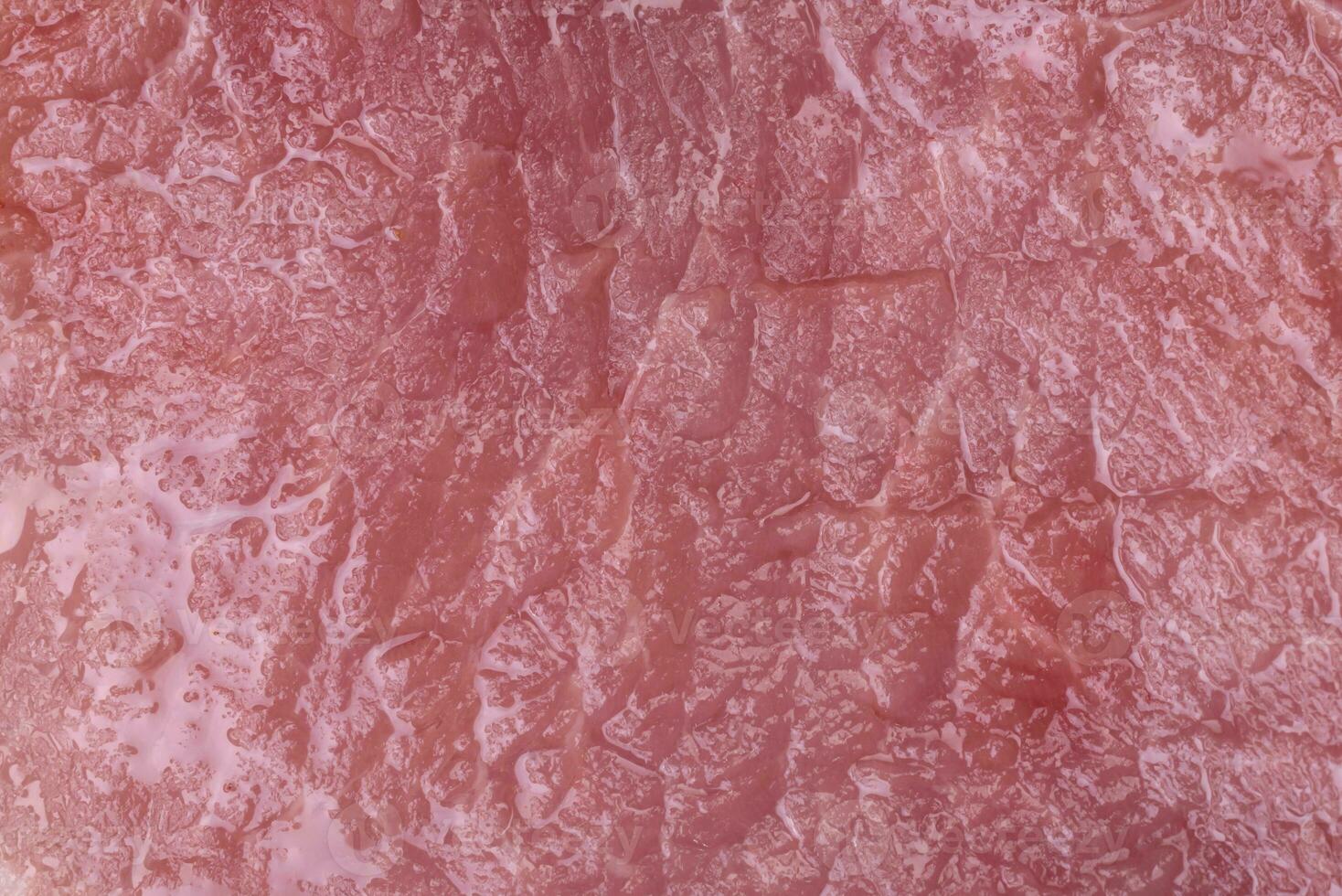 Raw pork on the bone or rib sliced with salt, spices and herbs photo