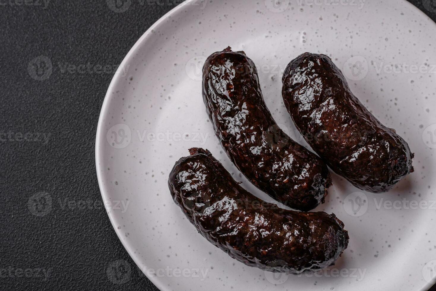 Delicious black blood sausage or black pudding with spices and herbs photo