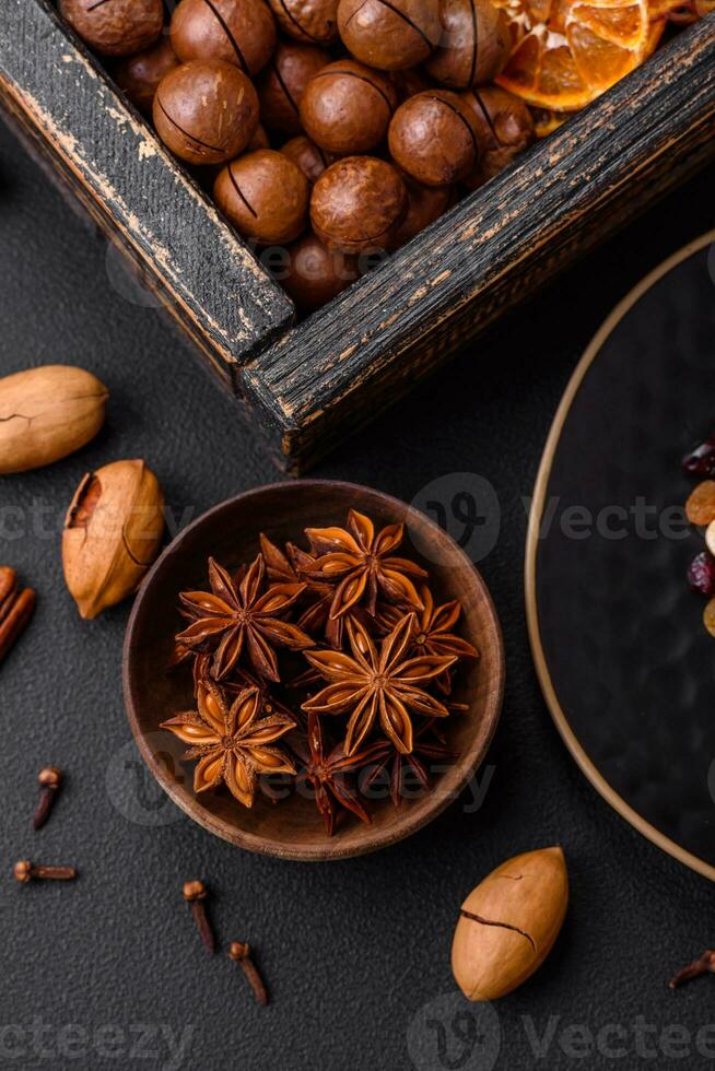 Roasted pecans and macadamia nuts, dried tangerine, dried berries photo