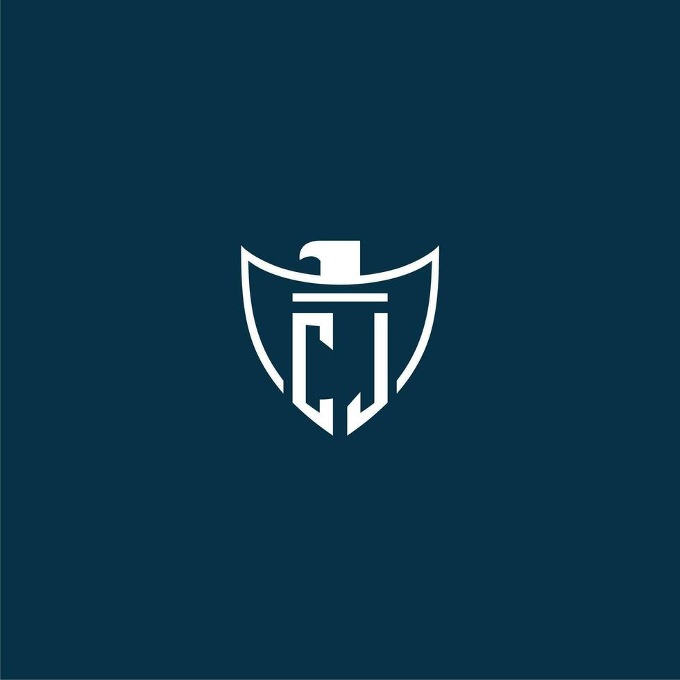 CJ initial monogram logo for shield with eagle image vector design