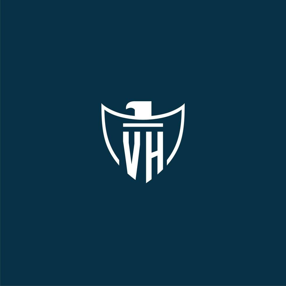 VH initial monogram logo for shield with eagle image vector design