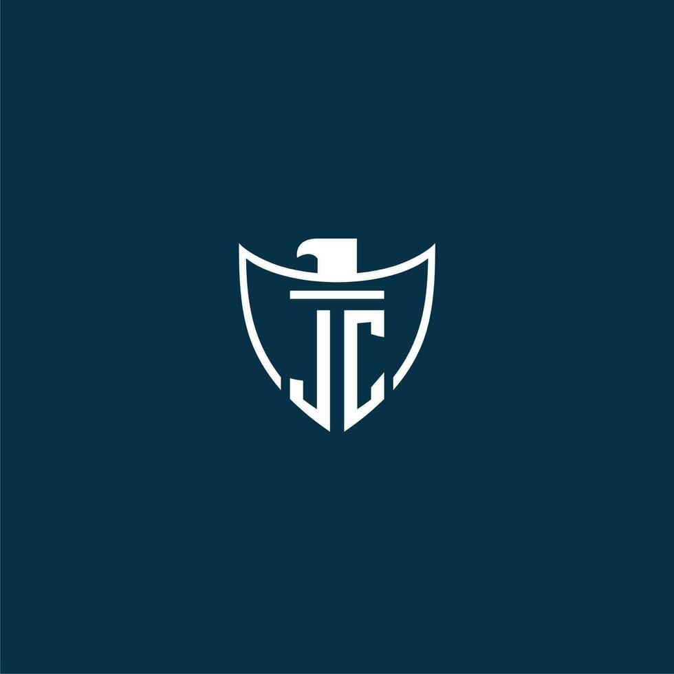 JC initial monogram logo for shield with eagle image vector design
