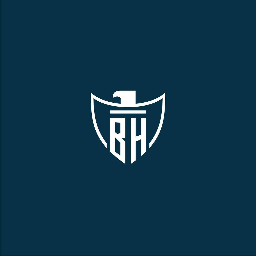 BH initial monogram logo for shield with eagle image vector design