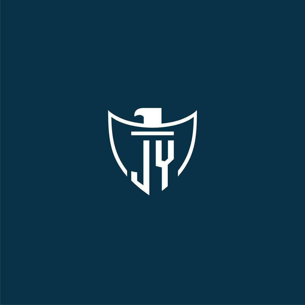 JY initial monogram logo for shield with eagle image vector design