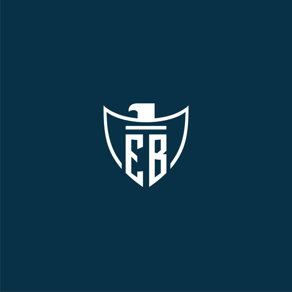 EB initial monogram logo for shield with eagle image vector design