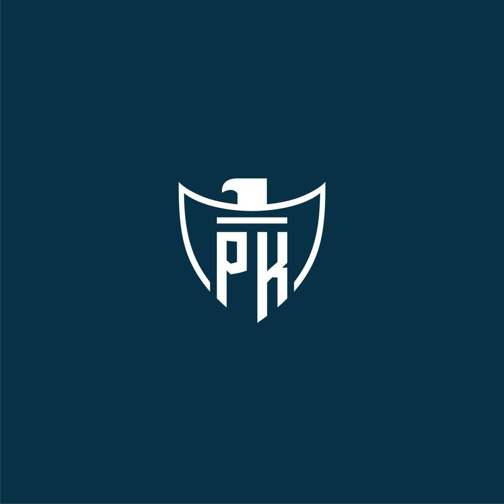 PK initial monogram logo for shield with eagle image vector design