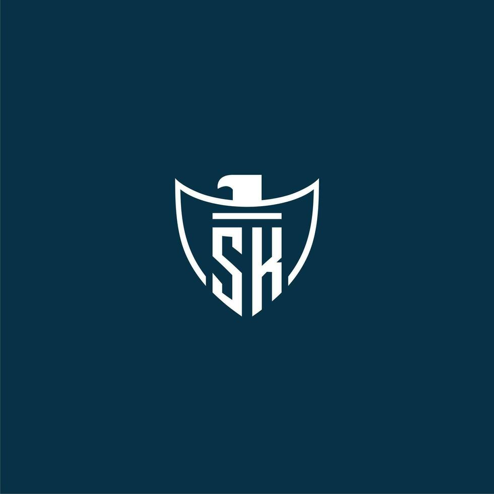 SK initial monogram logo for shield with eagle image vector design