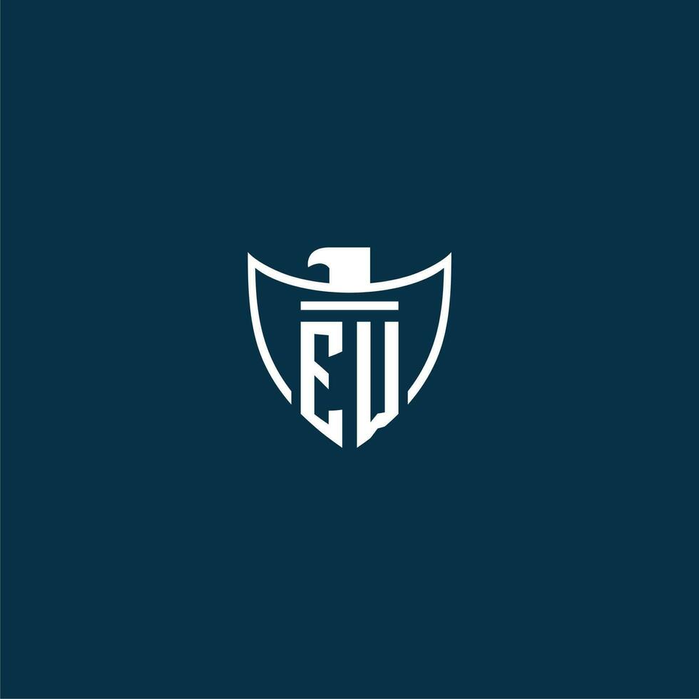 EW initial monogram logo for shield with eagle image vector design