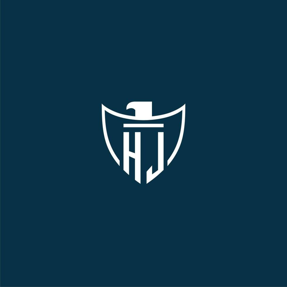 HJ initial monogram logo for shield with eagle image vector design