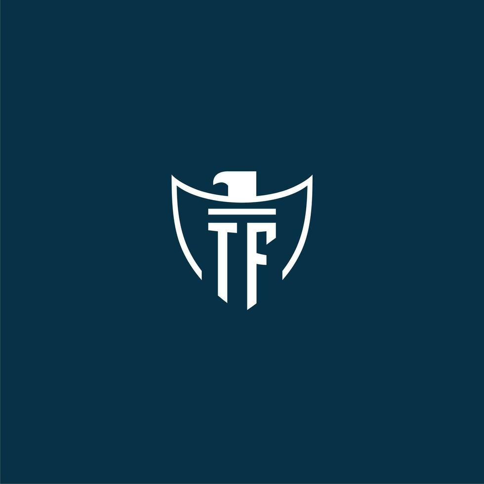 TF initial monogram logo for shield with eagle image vector design