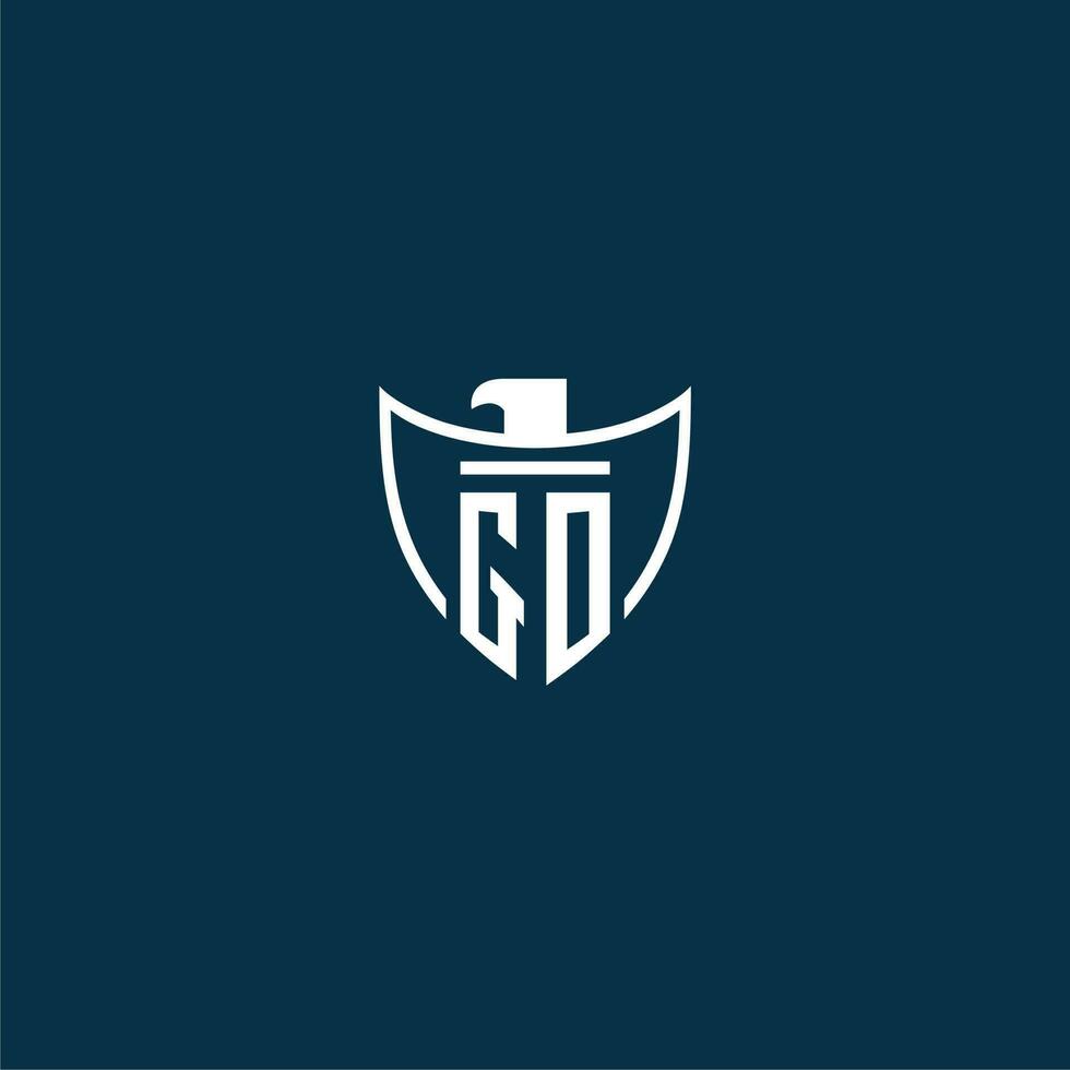 GO initial monogram logo for shield with eagle image vector design