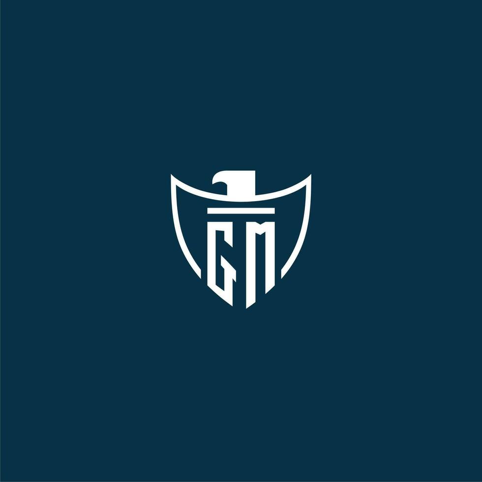 GM initial monogram logo for shield with eagle image vector design
