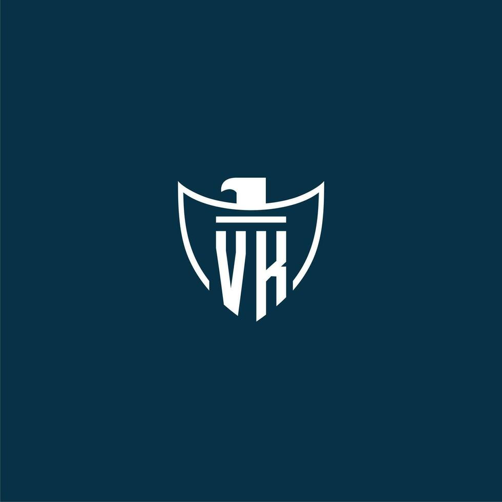 VK initial monogram logo for shield with eagle image vector design