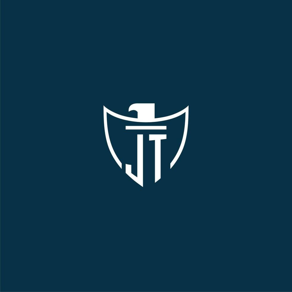 JT initial monogram logo for shield with eagle image vector design
