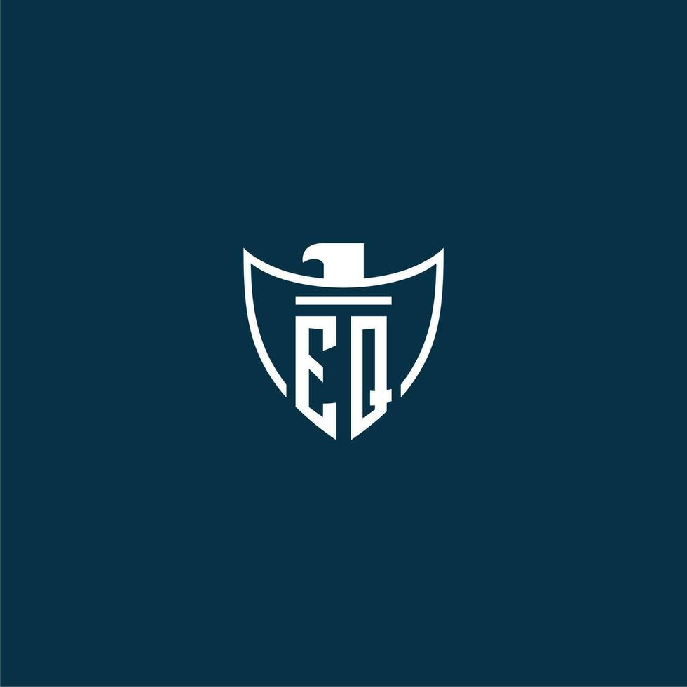 EQ initial monogram logo for shield with eagle image vector design