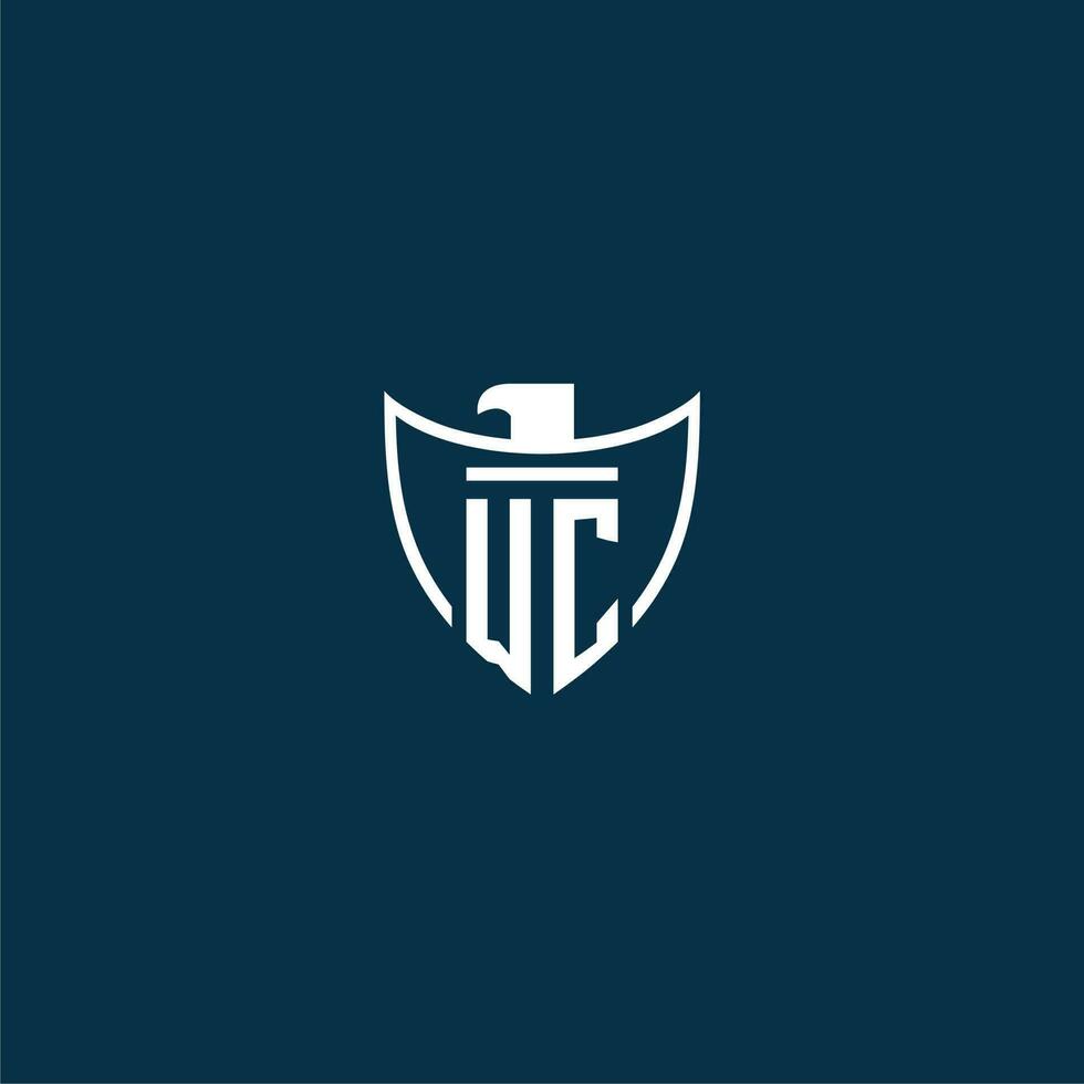 WC initial monogram logo for shield with eagle image vector design