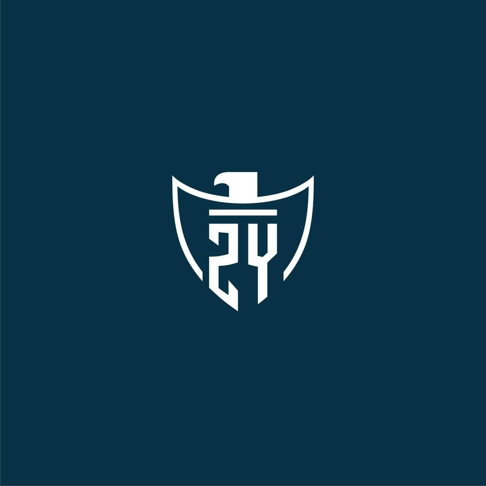ZY initial monogram logo for shield with eagle image vector design