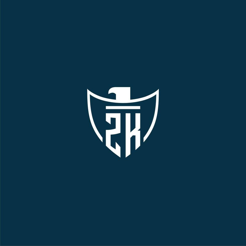 ZK initial monogram logo for shield with eagle image vector design