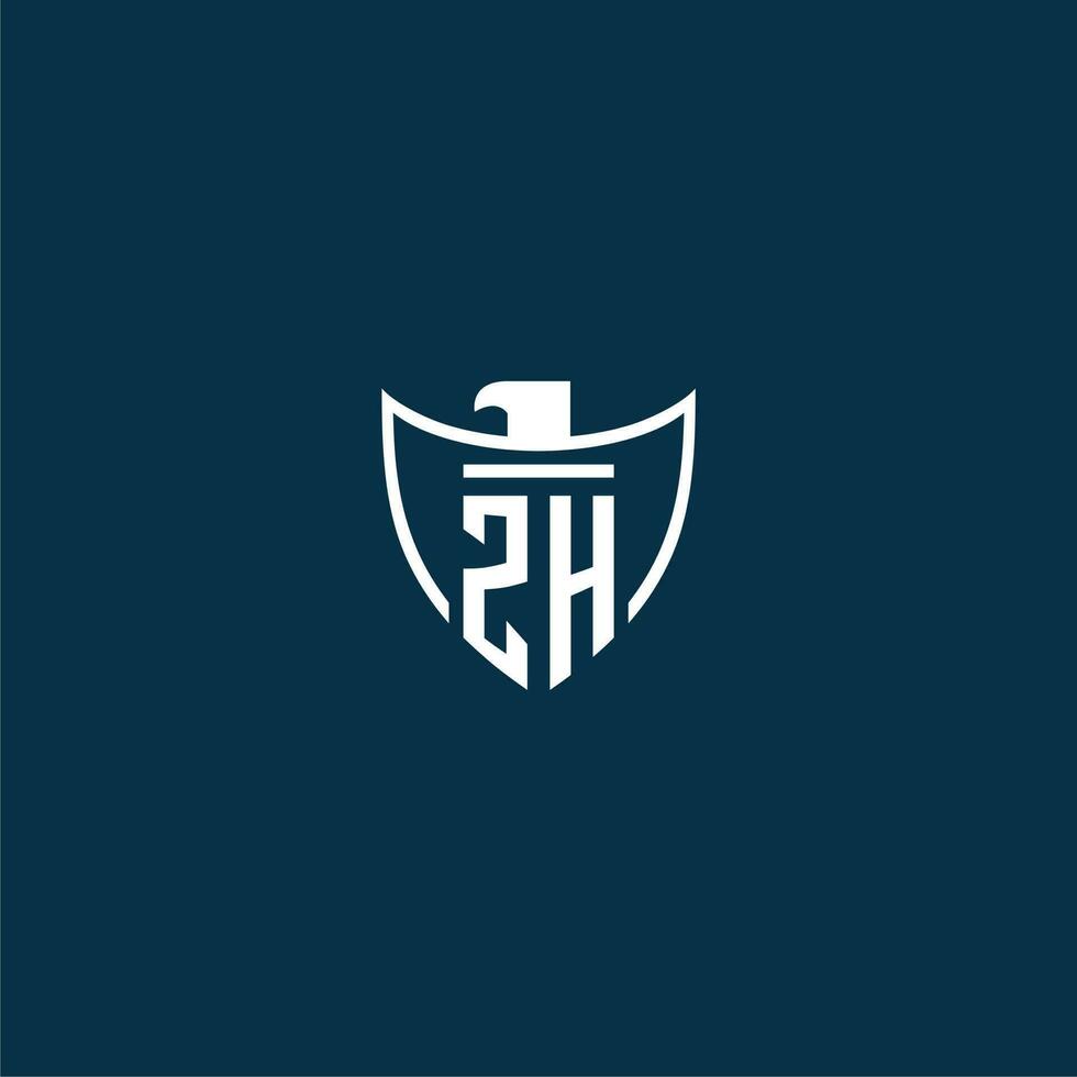 ZH initial monogram logo for shield with eagle image vector design