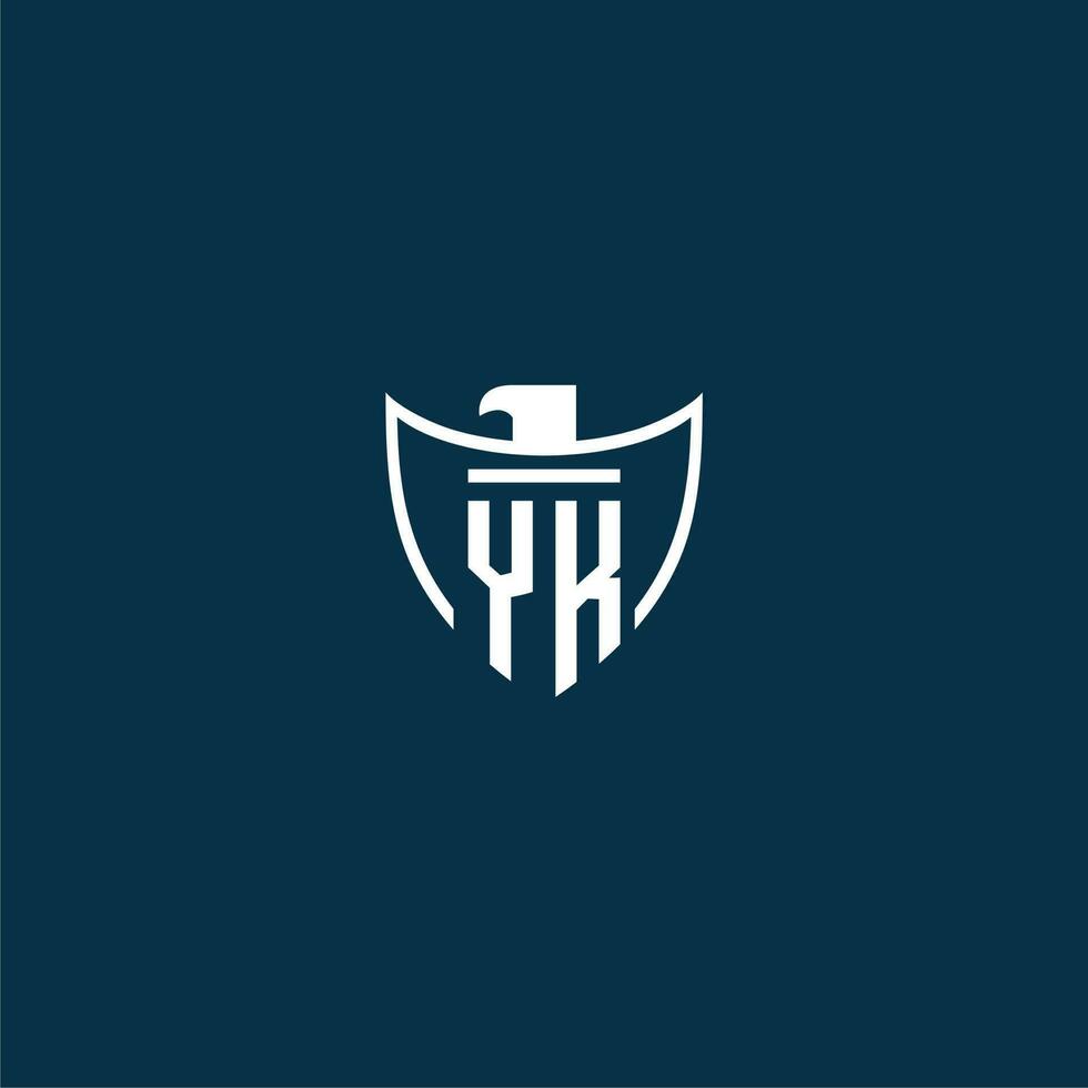 YK initial monogram logo for shield with eagle image vector design
